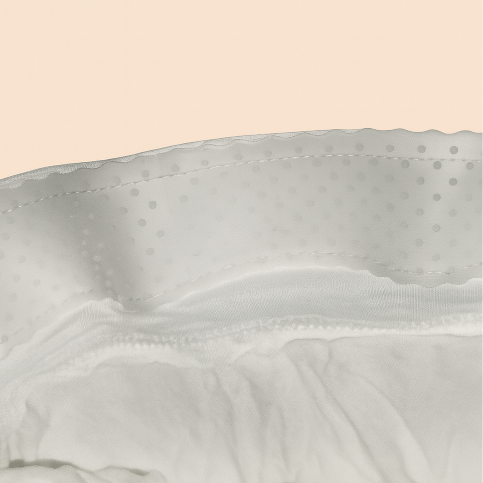 Close-up of a light gray fabric with a subtle pattern on a beige background